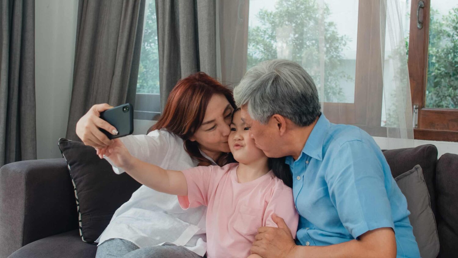 Athene Performance Elite 7 Review - Asian Grandparents Taking Selfie with Grandaughter