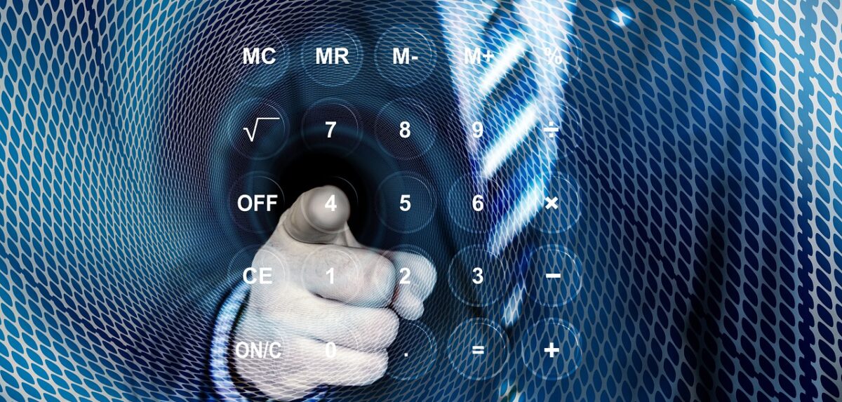 Business man pointing at glass with calculator keys on it. Compound interest calculator featured image.